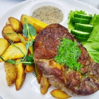 PORK STEAK WITH POTATO WEDGES